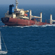 A photo of a huge ship sinking into the sea.